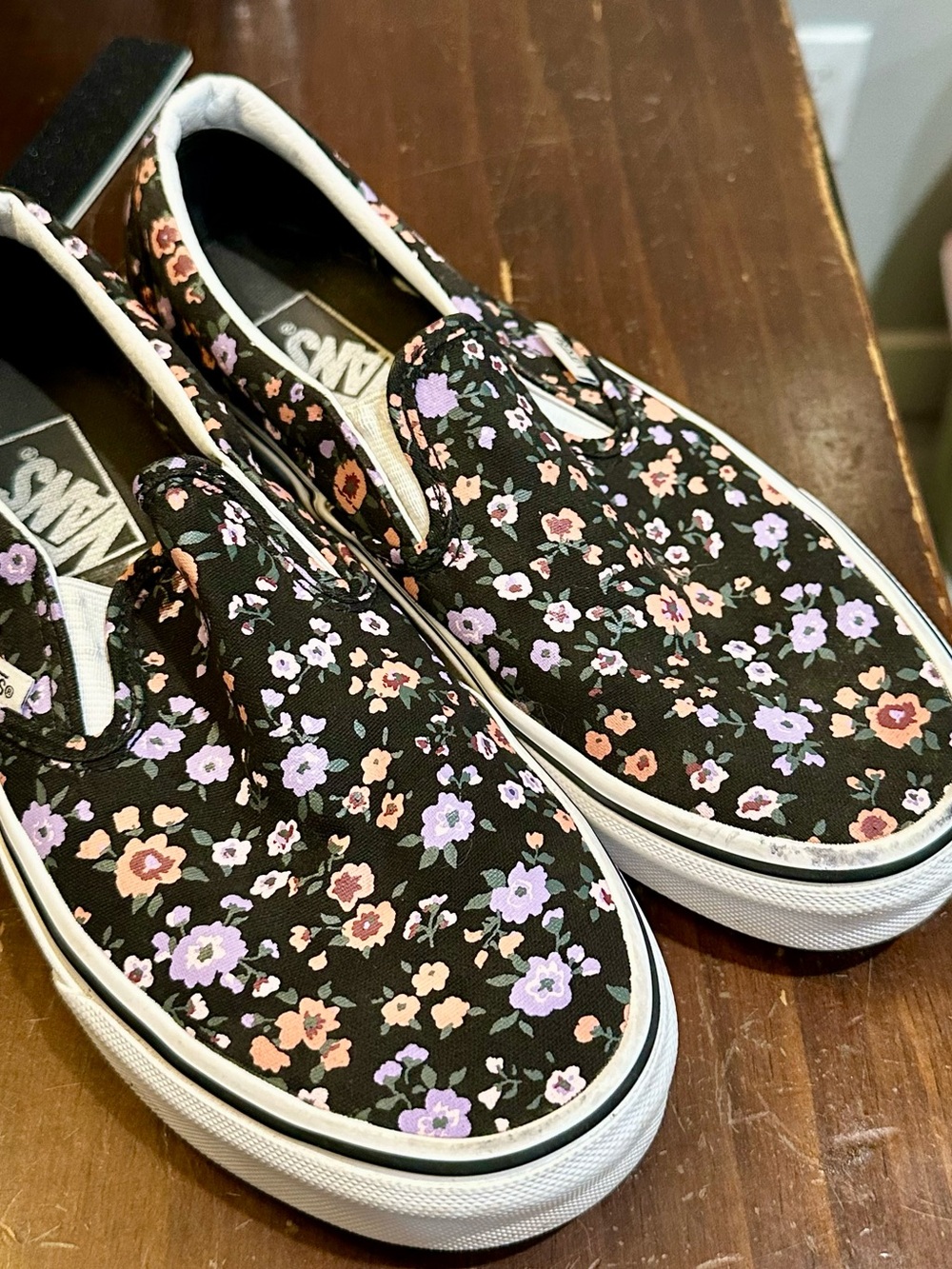 Vans Floral Slip-On Sneakers in Black with Lavender and Peach Flowers